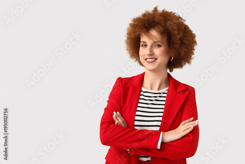 Redhead young woman with cu...