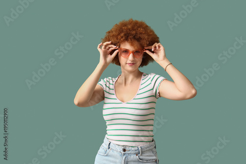 Redhead young woman with cu...