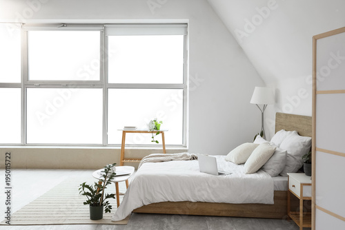 Interior of light bedroom w...