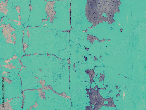 Blue peeling paint on the wall. Old concrete wall with cracked flaking paint. Weathered rough painted surface with patterns of cracks and peeling. High resolution texture for background and design.