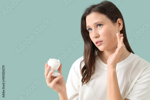 Young woman with acne probl...