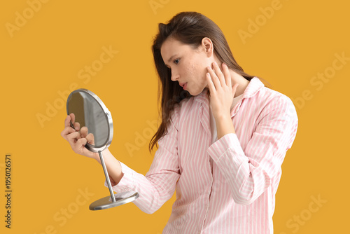 Young woman with acne probl...