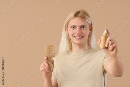 Young blonde man with hair ...