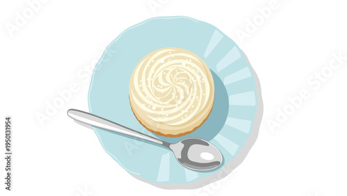 Delicious frosted cupcake or tart with a decorative swirl of vanilla cream served on a light blue scalloped plate with a silver spoon.
