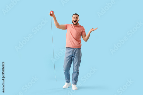 Young man with measuring ta...