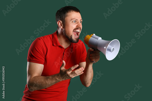 Young man shouting into meg...