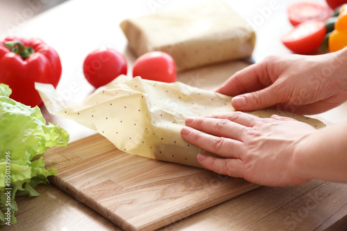 Young woman wrapping tasty ...