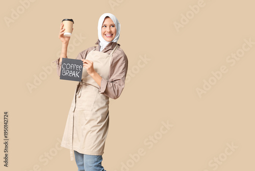 Happy young female barista ...