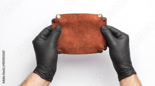 Canvas Print Tanner holds a leather organizer on a white background