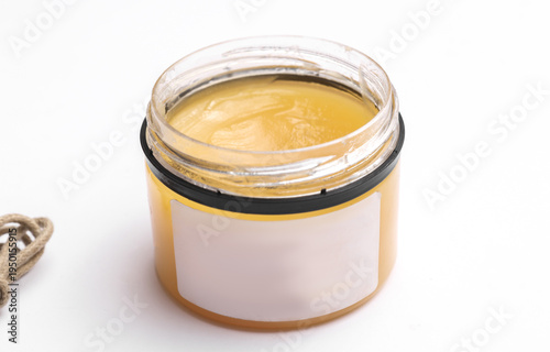 Shoe cream in jar on a white background