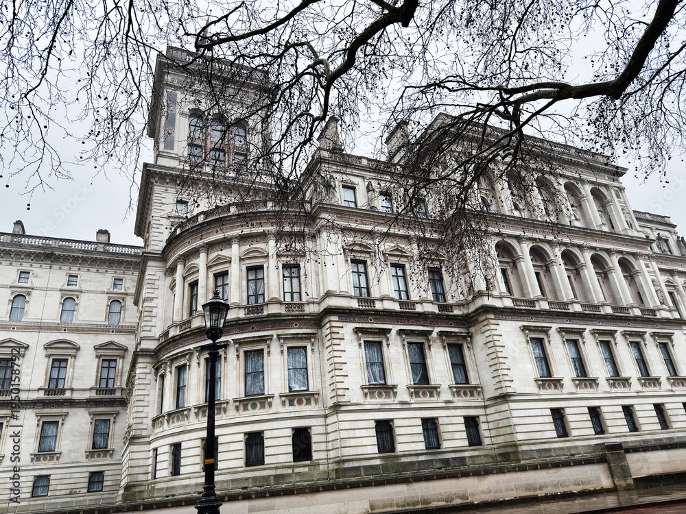 Naklejka premium London historic building with ornate architecture and grand stone facade along a city street