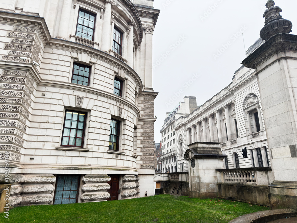 Fototapeta premium Historic neoclassical Churchill War Rooms government building architecture in London UK with ornate stone facade and curved corner