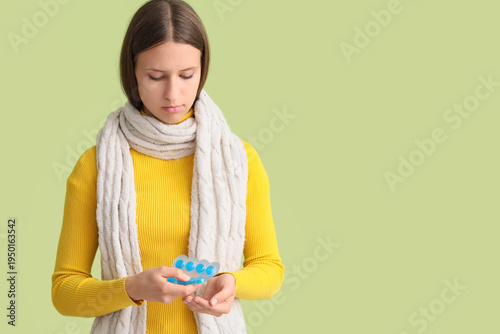 Ill young woman taking thro...