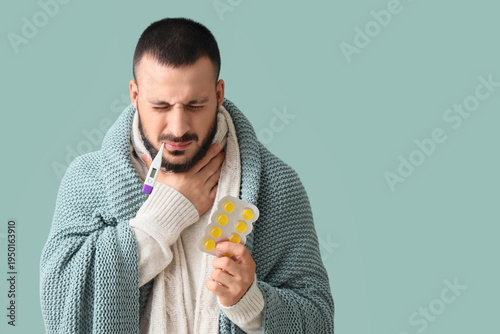 Ill young man with throat l...