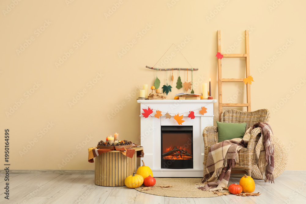 Fototapeta premium Interior of living room with fireplace, armchair and autumn decor