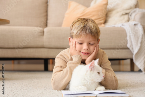 Cute little boy with cat an...