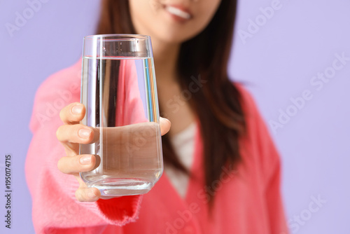Young woman with glass of w...