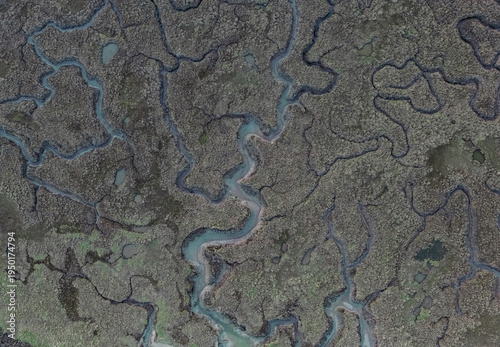 Фотография Aerial view of tidal channels and salt marsh patterns at Burnham Overy Staithe,