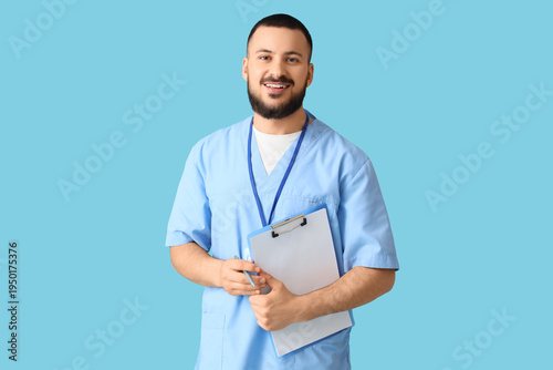 Male doctor with clipboard ...
