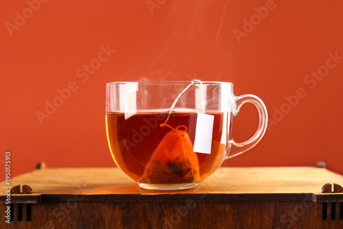Cup of hot tea on wooden ta...