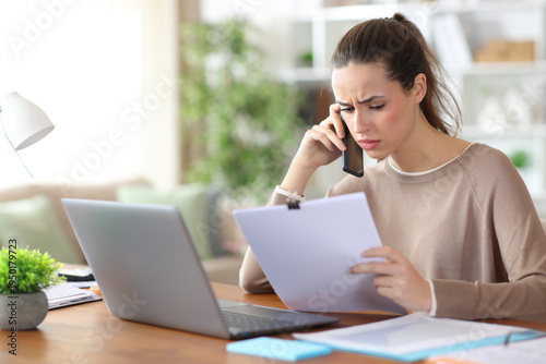 Worried self employed working online and talking on phone