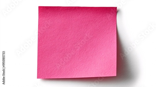 Pink sticky note pad with curl on white background under bright light