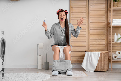 Shocked young woman with ha...