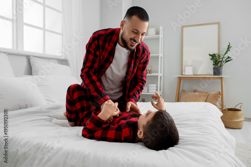 Happy father in checkered p...