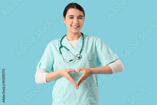 Female doctor making heart ...
