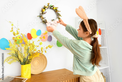 Cute girl in bunny ears wit...