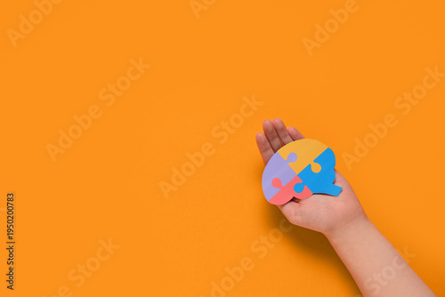 Female hand holding colorfu...
