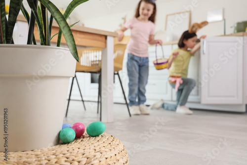 Easter eggs on pouf against...