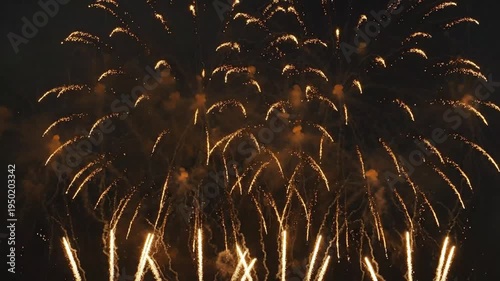 Dramatic display of luminous pyrotechnics exploding against a dark background