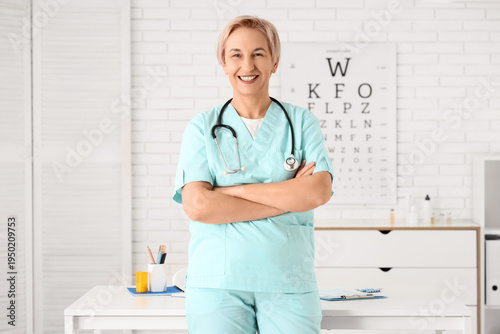 Happy mature female doctor ...