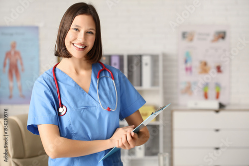 Happy young female doctor w...