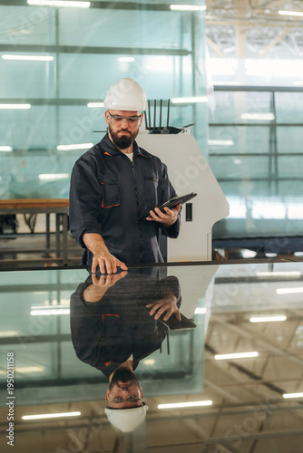 Wallpaper Mural Big storage area, Warehouse worker in an industrial environment of a factory Torontodigital.ca