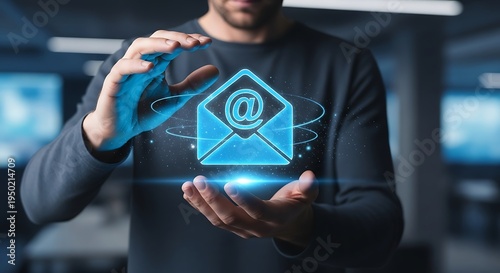 Email marketing concept - Man holding a digital email icon.