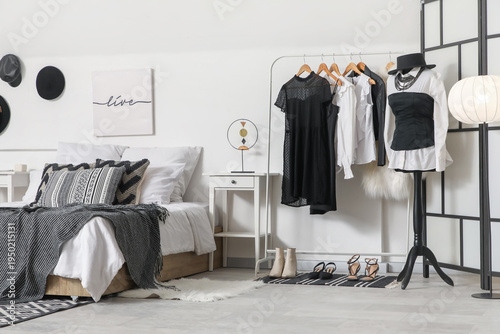 Rack with clothes and foldi...