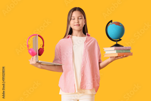 Happy teenage Asian girl wi...