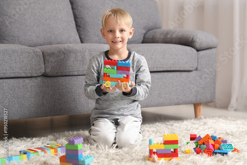 Happy cute little boy playi...