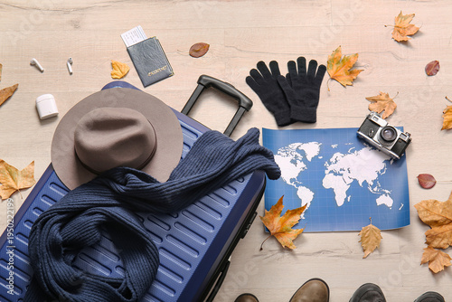 Blue suitcase with world ma...