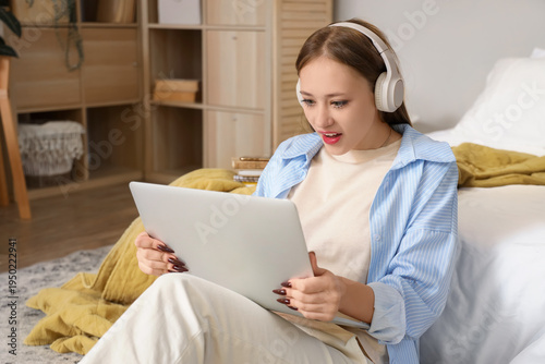 Young woman with headphones...