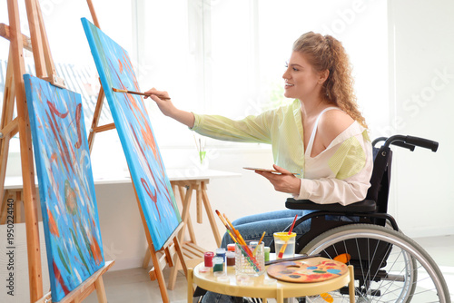 Female artist in wheelchair...