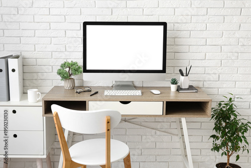 Stylish workplace with comp...