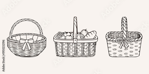 Three vintage style picnic baskets with fruits bread and decorative bows