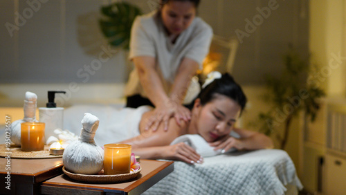 Canvas Print Aromatherapy massage ambiance or spa salon composition setup, focus decor candle