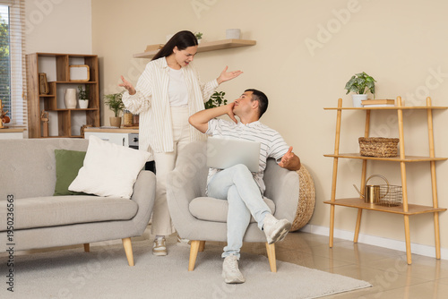 Young woman quarreling with...