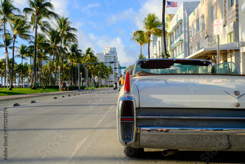 Tableau sur toile Ocean Drive, the main street of Miami Beach with a vintage 1950s American car parked