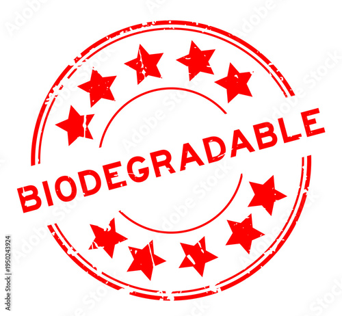 Grunge red biodegradable word with star icon round rubber seal stamp on white background