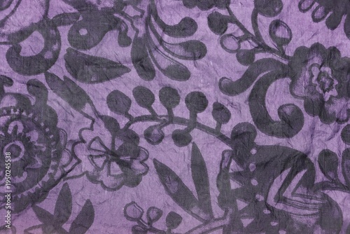 Black flowers pattern purple scarf fabric background